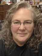 Picture of Jodi Baldacci, 60 yr old female, with gray hair and glasses